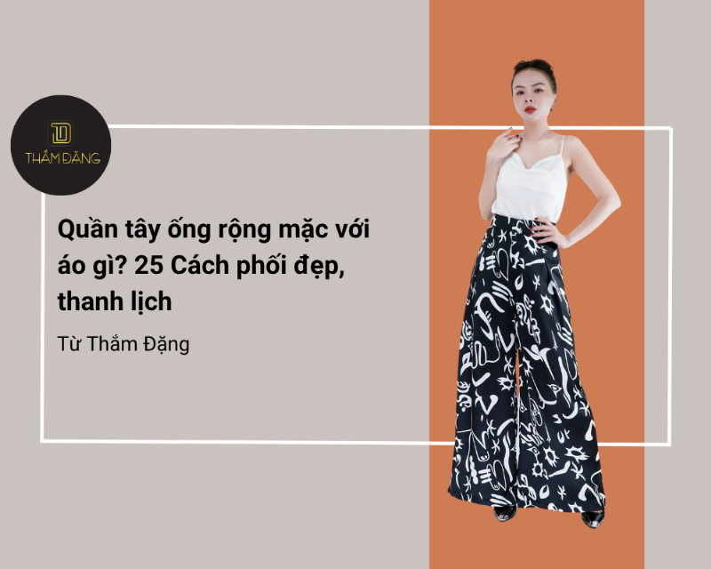 Một cô gái quyến rũ mặc áo vest gile nữ dáng ngắn màu đen như một chiếc áo độc lập, kết hợp với quần âu cùng màu và phụ kiện vàng, toát lên vẻ sang trọng, cá tính.